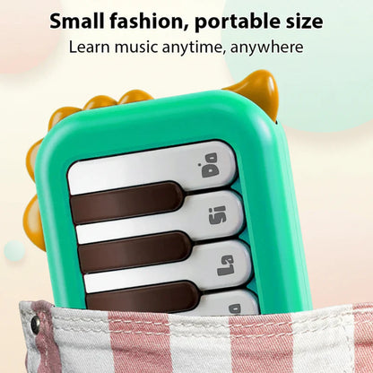 Top view of a compact electronic piano for kids, featuring lighted keys and portable design