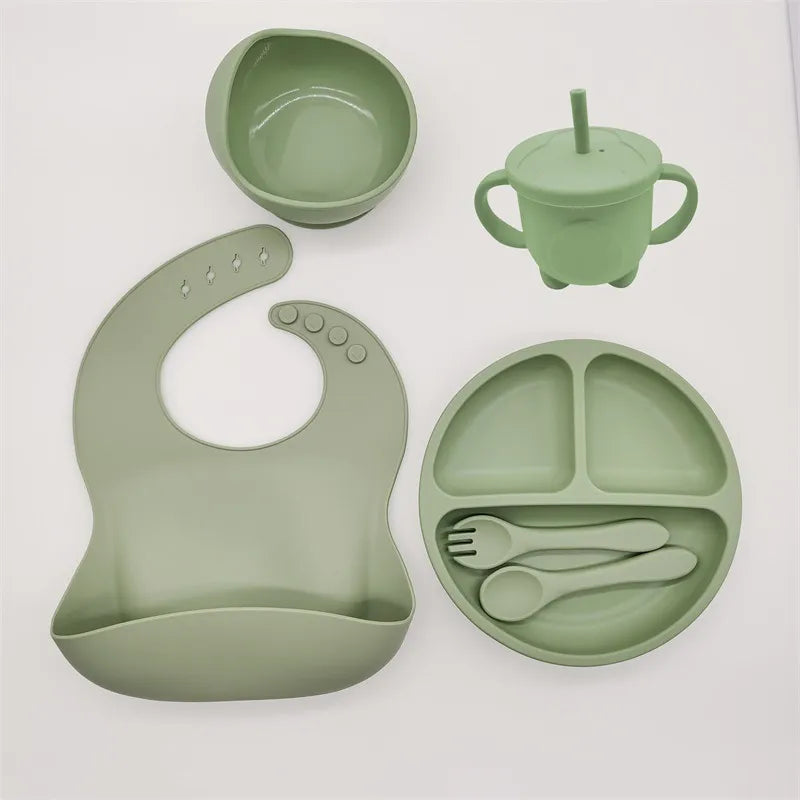 Mint green silicone baby suction plate, bib and cutlery set for mess-free mealtime