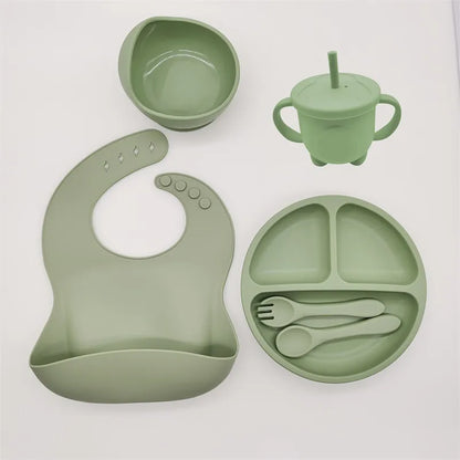 Mint green silicone baby suction plate, bib and cutlery set for mess-free mealtime