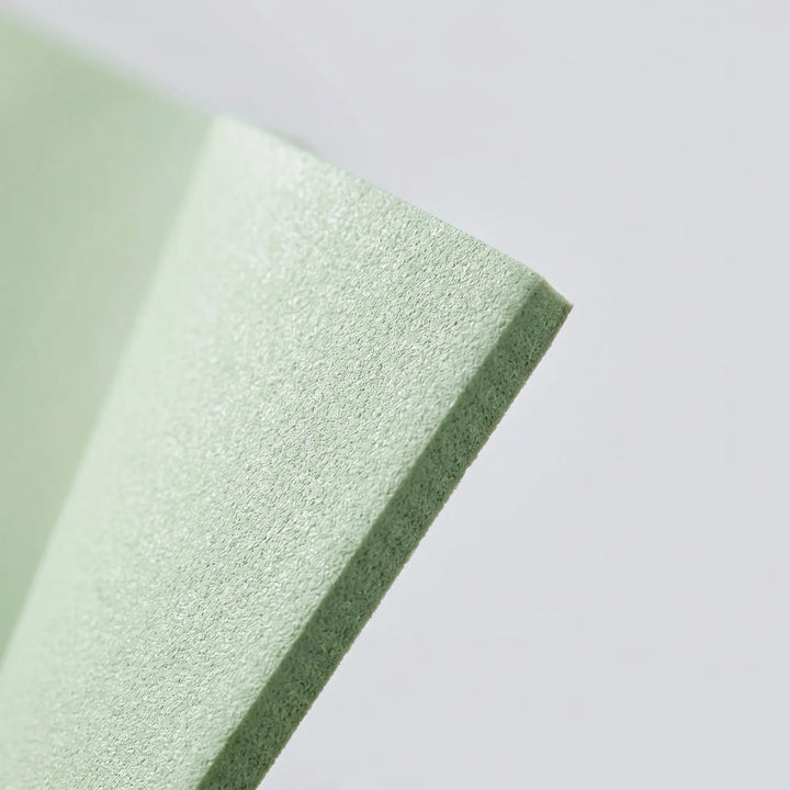 Unisex fitness mat in mint green, designed with alignment guides for effective yoga & Pilates practice.