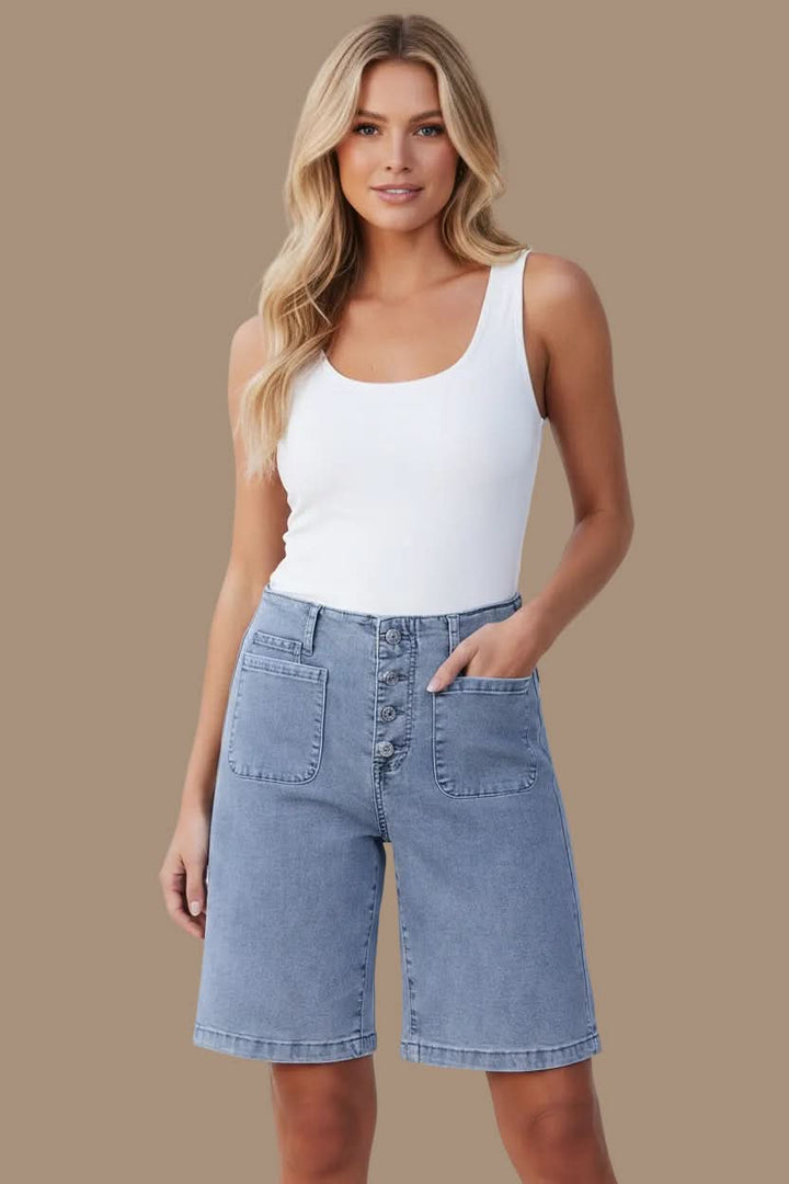 Model wearing trendy high-waist Bermuda shorts, relaxed fit, perfect for summer casual style.