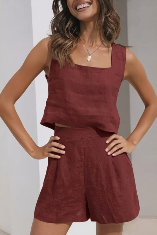 Woman enjoying a coastal view in a fashionable women's airy summer shorts set, ideal resort wear.