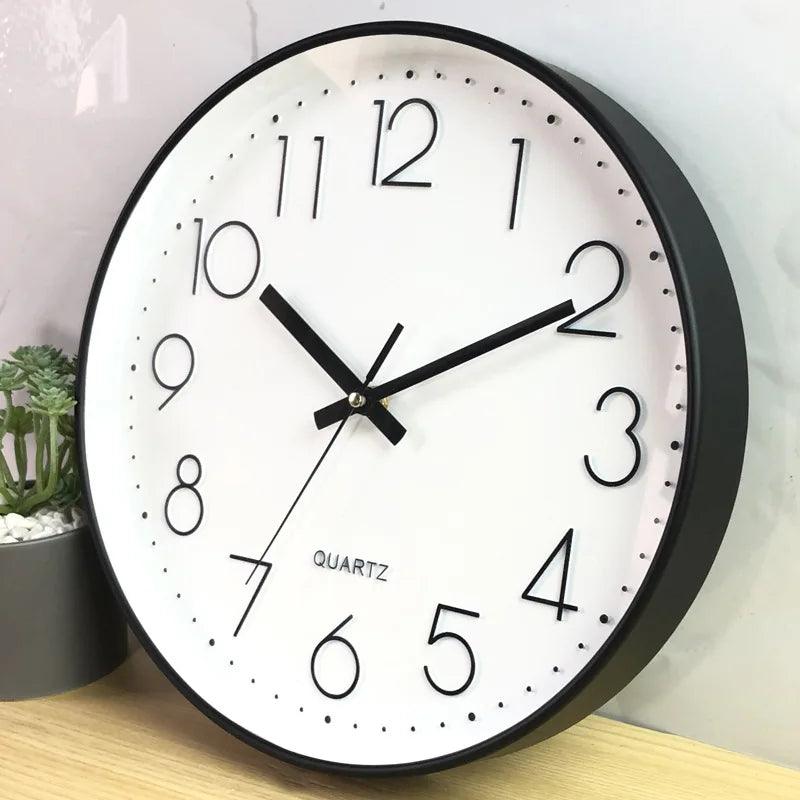 Minimalist 12-inch non-ticking wall clock. Quiet quartz movement, perfect for modern office decor.