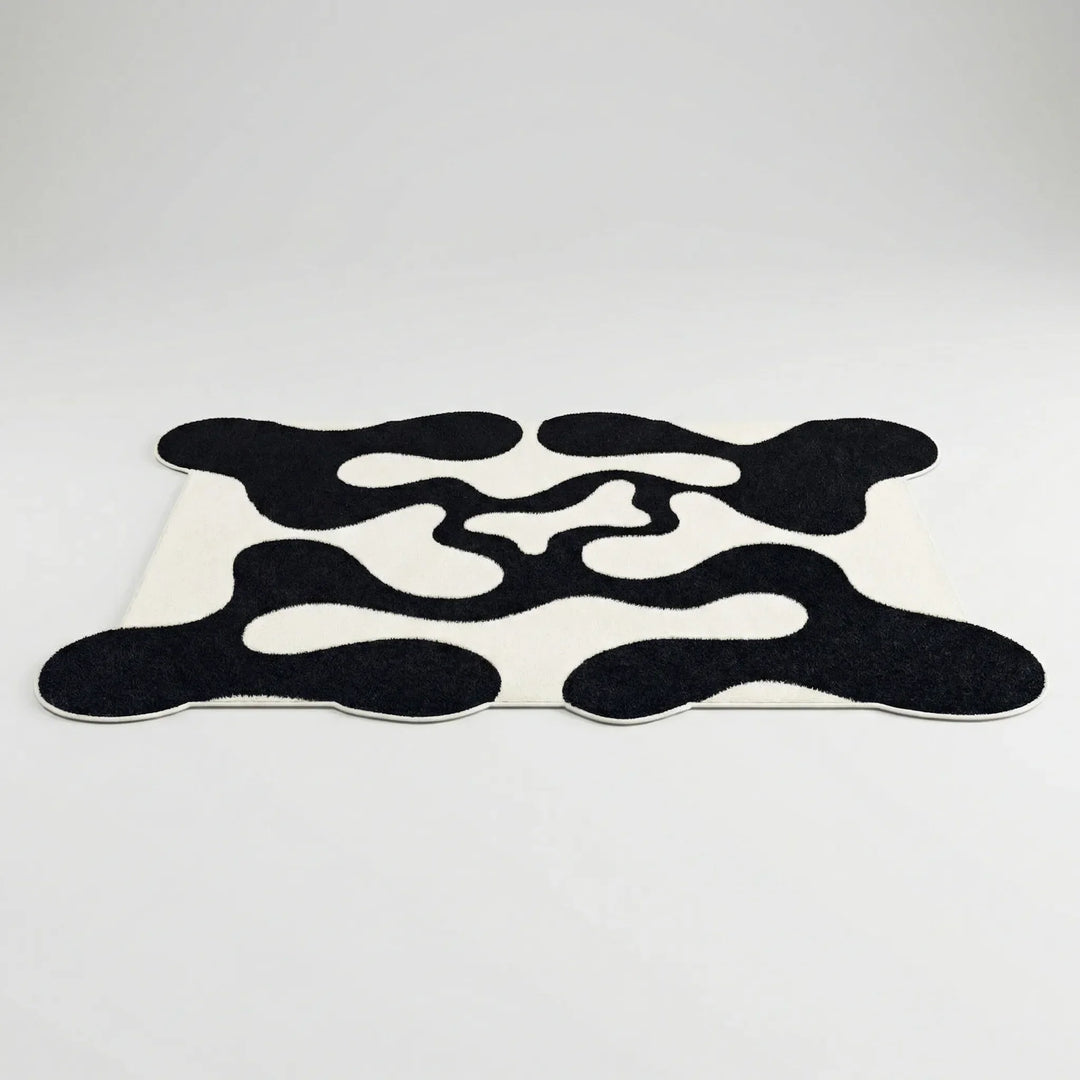 Contemporary abstract wave area rug, Flowique statement floor covering for modern home decor, unique geometric pattern.