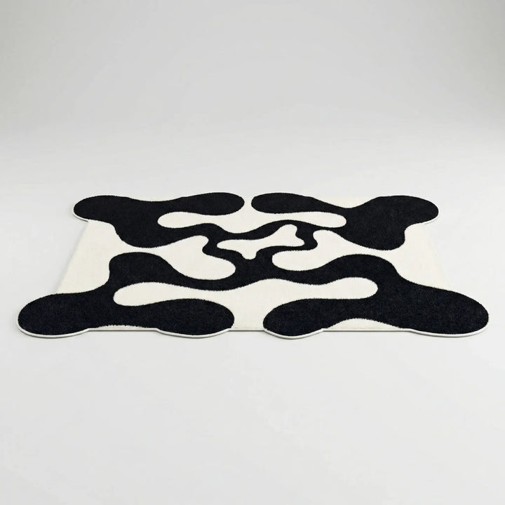 Contemporary abstract wave area rug, Flowique statement floor covering for modern home decor, unique geometric pattern.