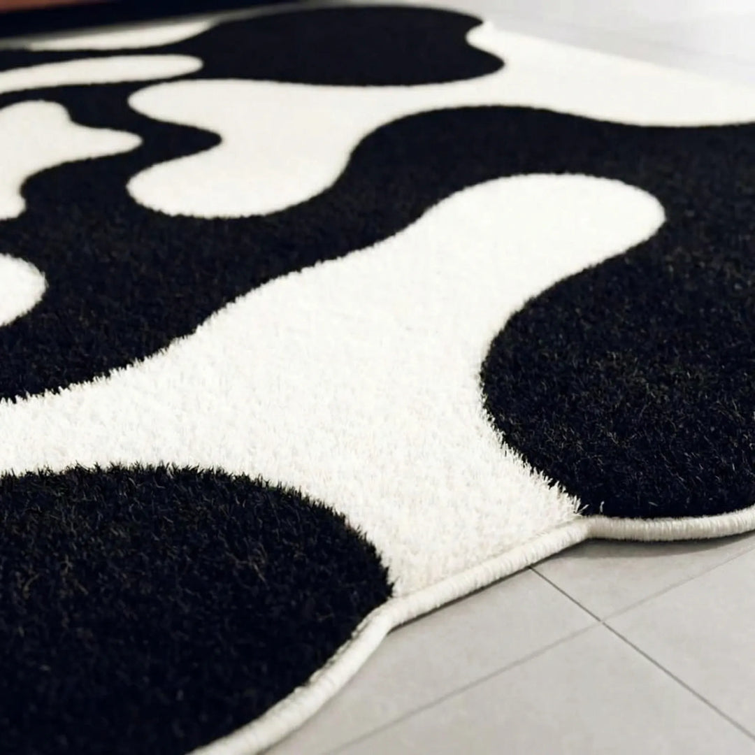 Stylish modern abstract wave area rug by Flowique. Contemporary geometric floor covering for a chic living room or office.