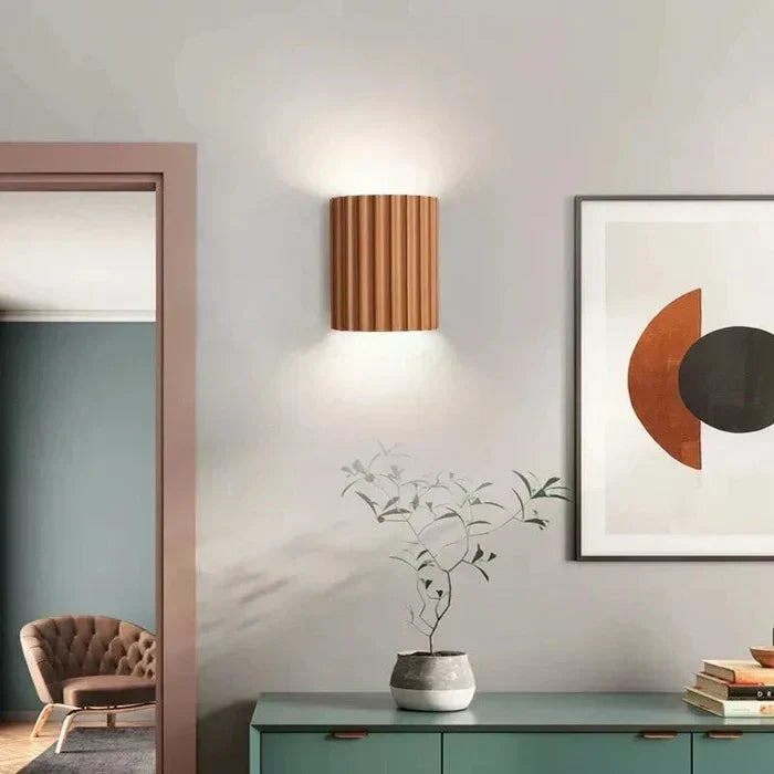 Modern LED ArtisticWave wall lamp for bedroom, provides soft ambient lighting.