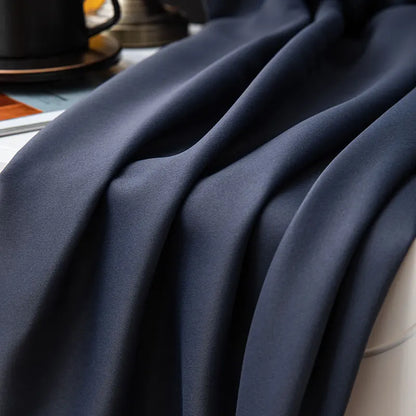 Black bedroom blackout curtains from outside, providing privacy and a sleek, uniform exterior look