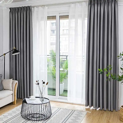 Close-up of modern black blackout curtain fabric, showing dense weave for thermal insulation and privacy