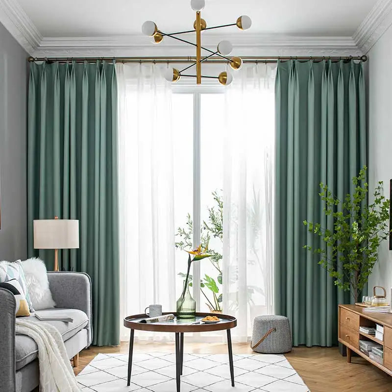 Full view of black modern drapes in a stylish living room, enhancing decor and blocking light