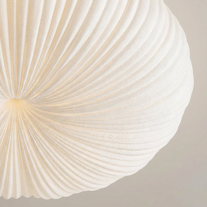 Contemporary Ciravine flush mount LED light providing soft, dimmable ambient glow for stylish living room decor.