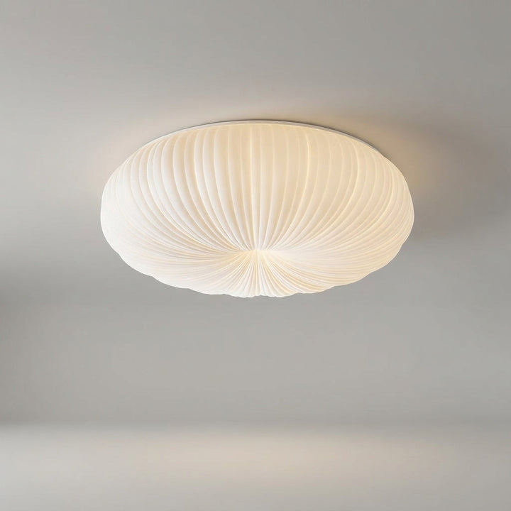 Modern LED flush mount ceiling light, energy-saving for dimmable ambient illumination in bedrooms and living rooms.