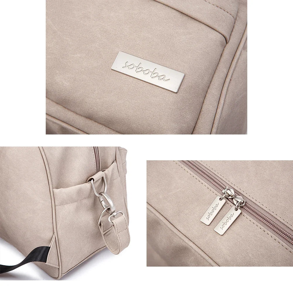 Close-up of modern diaper backpack's organized front pocket with zippers, baby gear, parent bag