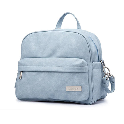 Details of modern diaper backpack's insulated bottle pocket, functional design, baby bag
