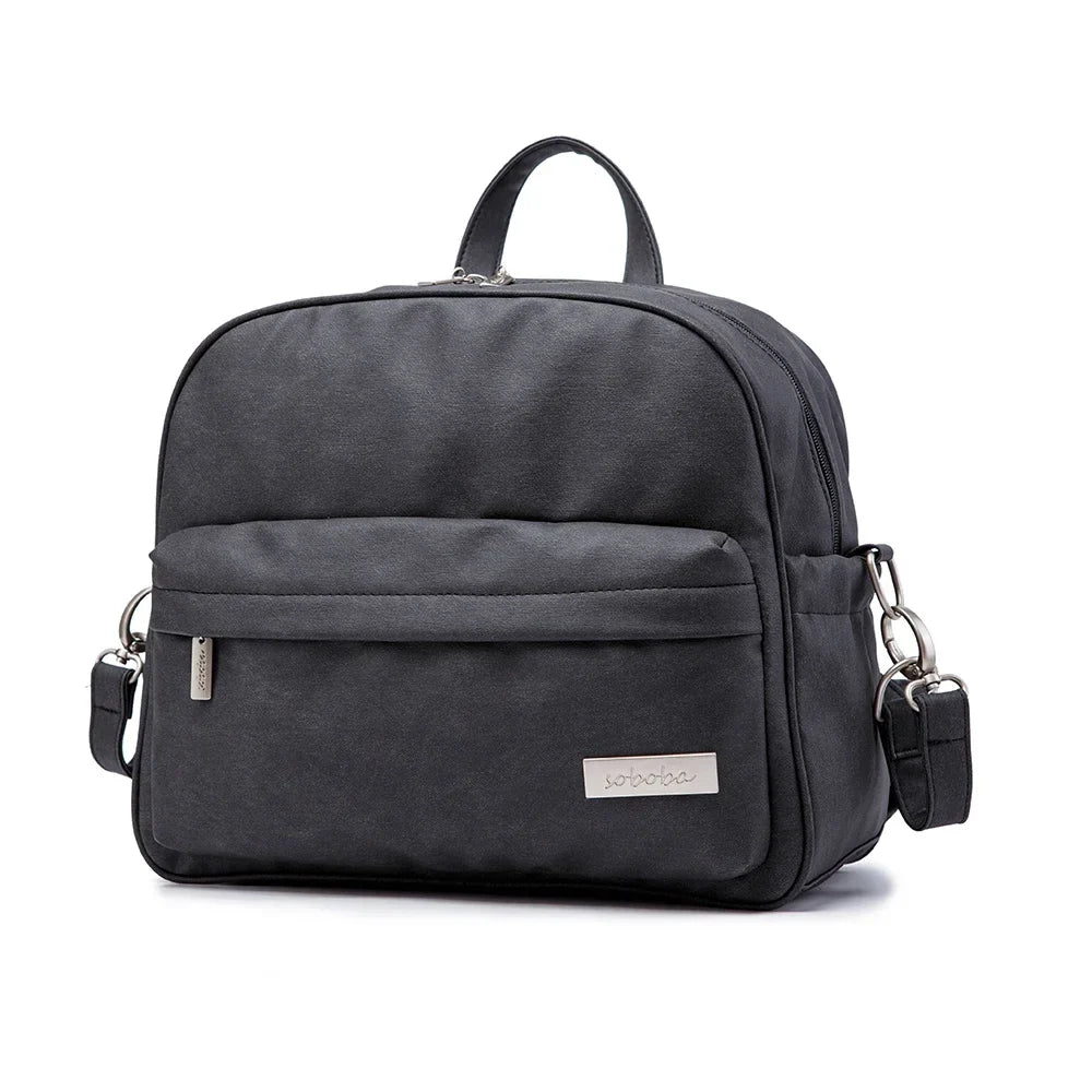 Modern diaper backpack in dark gray, showcasing the spacious main compartment and pockets