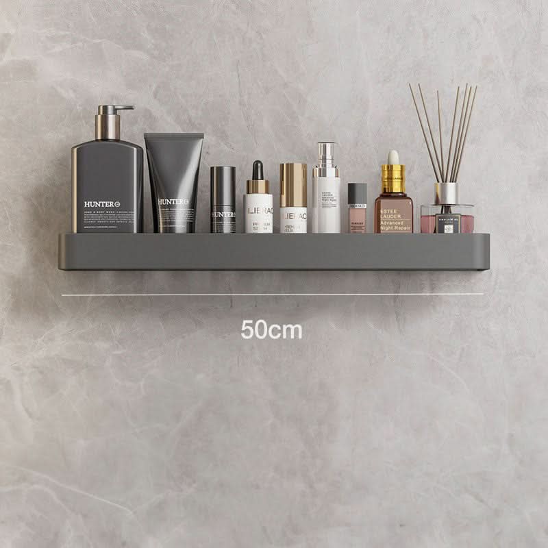 Efficient modern bathroom wall organizer. No drilling needed for this durable adhesive shelf.