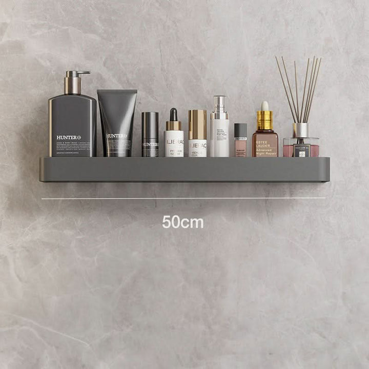 Efficient modern bathroom wall organizer. No drilling needed for this durable adhesive shelf.