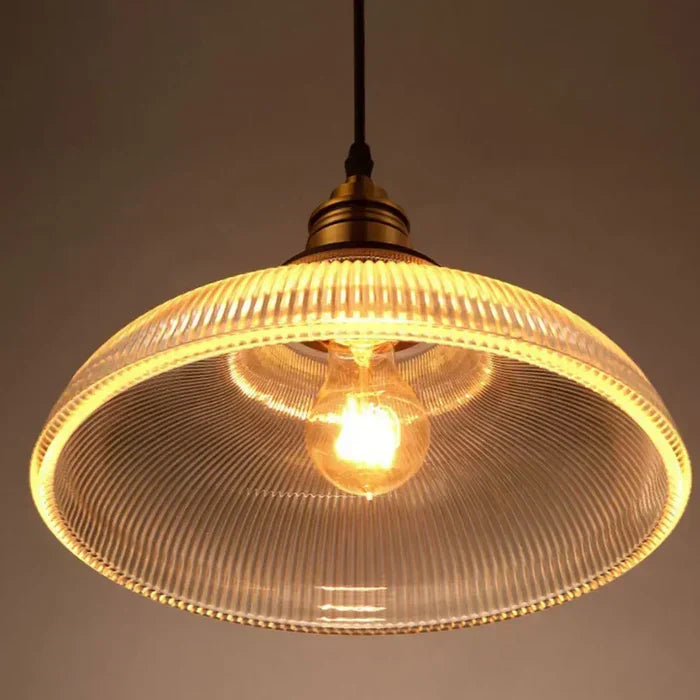 Contemporary glass pendant light fixture, minimalist design, ideal for modern home decor & ambient illumination.