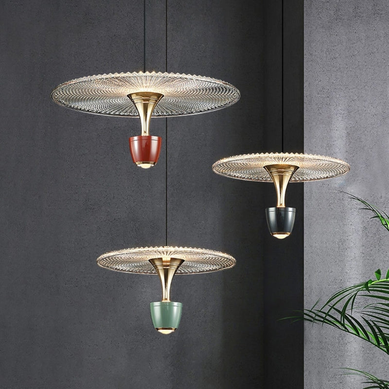 Contemporary pendant light casting ambient light, perfect for modern dining rooms or living spaces.