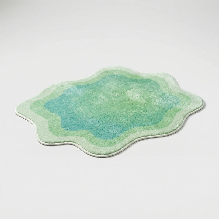 Flowique statement area rug featuring a colorful gradient wave design for modern homes.