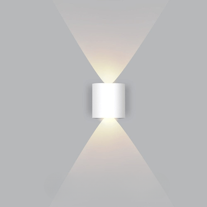 Modern LED outdoor wall light mounted on a house, providing energy-efficient & weatherproof exterior illumination.