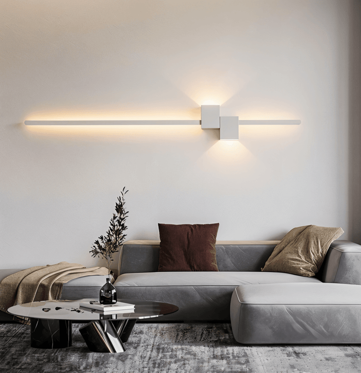 White minimalist linear LED wall light, indirect and energy-efficient accent lighting.