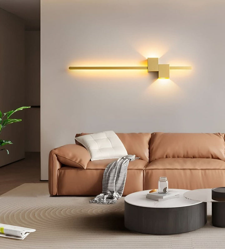 Elegant gold linear LED accent wall light, modern indirect lighting for home decor.