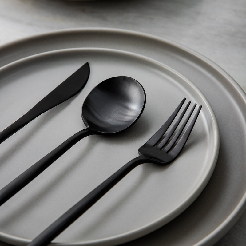 PureSet minimalist dinnerware accessories, including forks, knives, and spoons.