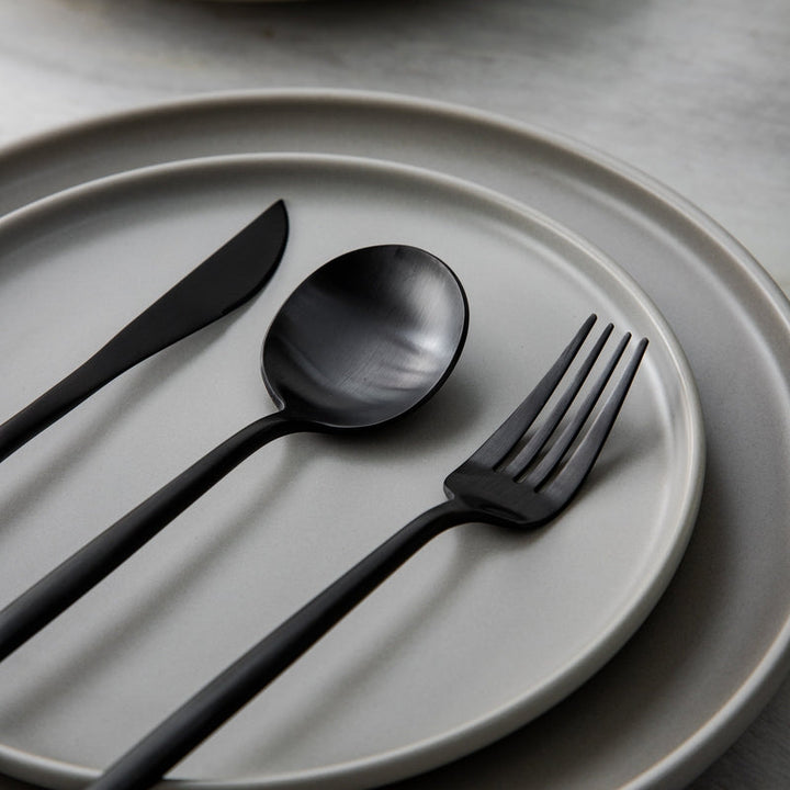 PureSet minimalist dinnerware accessories, including forks, knives, and spoons.