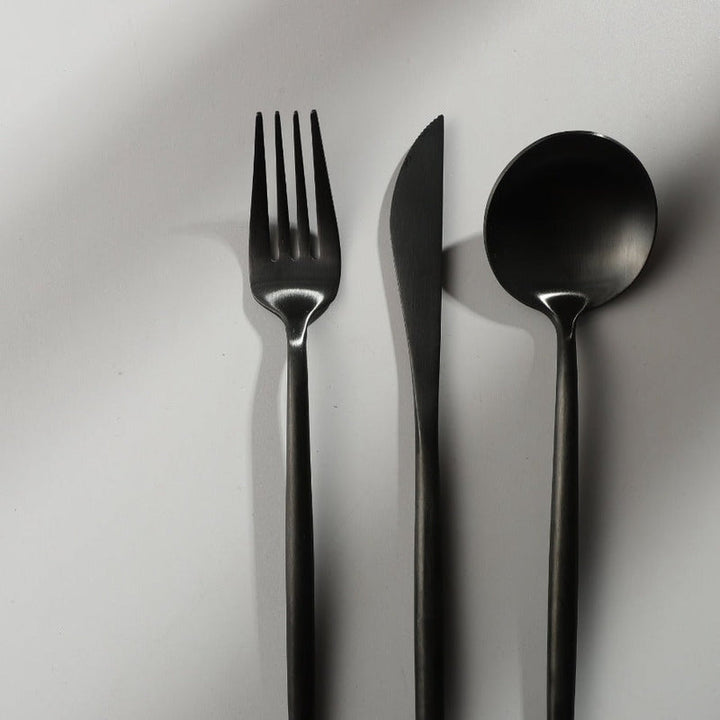 PureSet minimalist flatware displayed against a neutral background, highlighting its design.