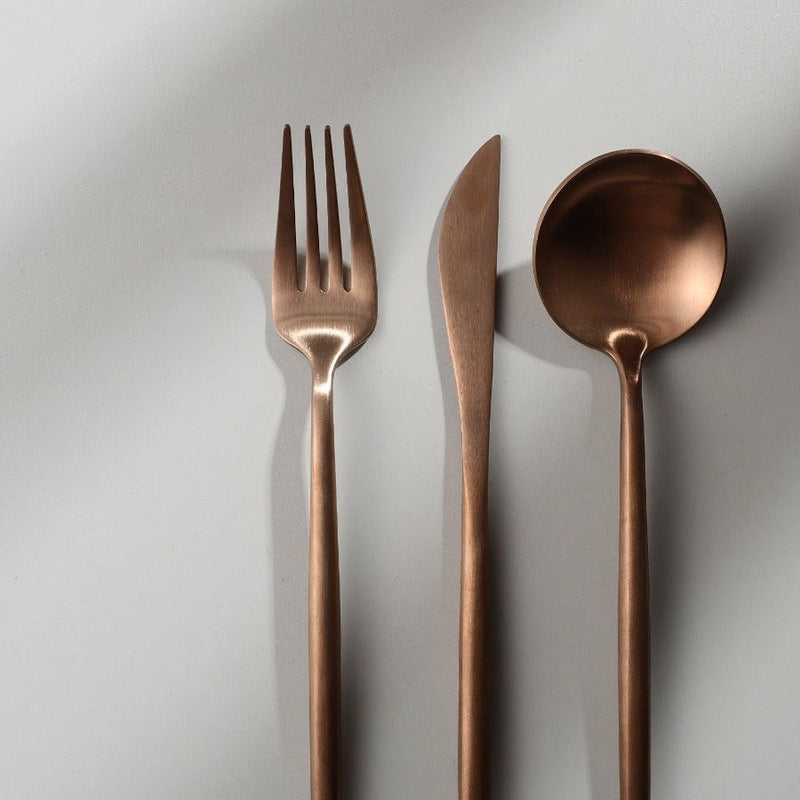 Focus on the balanced weight of the PureSet modern cutlery, perfect for dining.