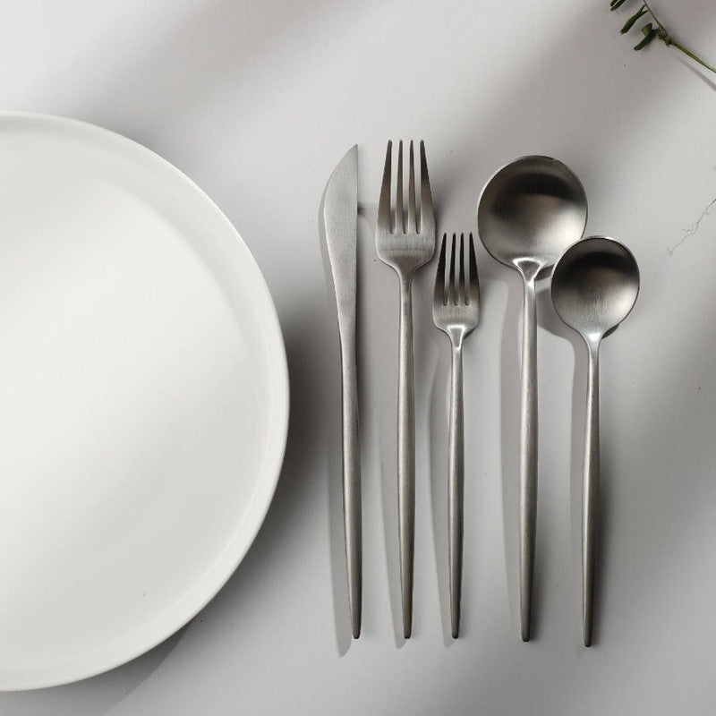 A single PureSet modern dinner fork, showcasing its clean lines and polished finish.