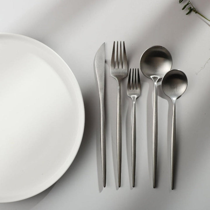 A single PureSet modern dinner fork, showcasing its clean lines and polished finish.