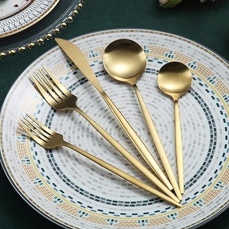 Complete PureSet modern cutlery set arranged artfully on a contemporary dining table.