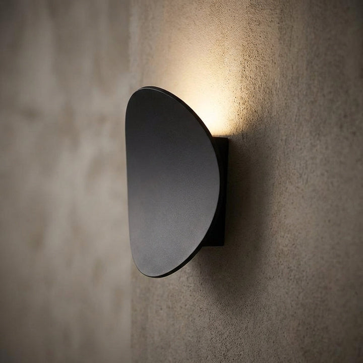 Modern minimalist Serevex LED wall sconce providing elegant ambient lighting; energy-efficient aluminum fixture for indoor decor.