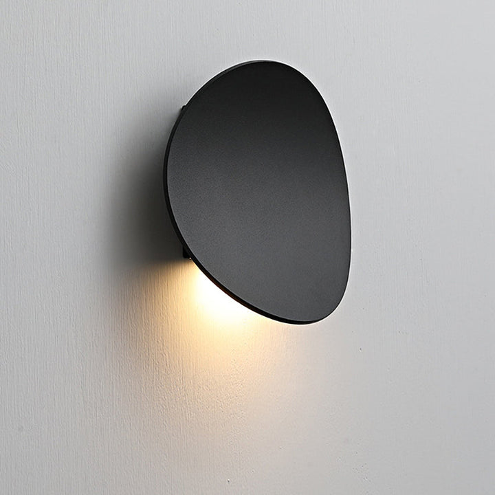 Durable aluminum modern minimalist Serevex LED wall sconce. Energy-efficient indoor lighting with ambient glow for home decor.