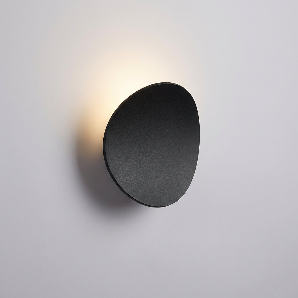 Minimalist Serevex LED wall sconce mounted, casting warm ambient light. Modern aluminum fixture for stylish and energy-efficient decor.