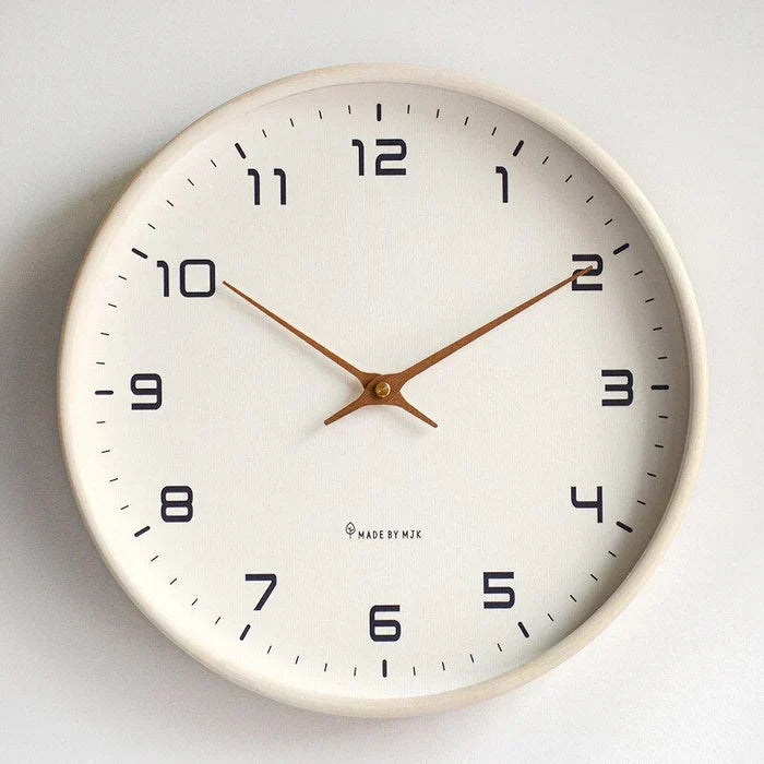 Minimalist wooden wall clock, modern decor piece. Natural wood finish, silent movement for any living space.