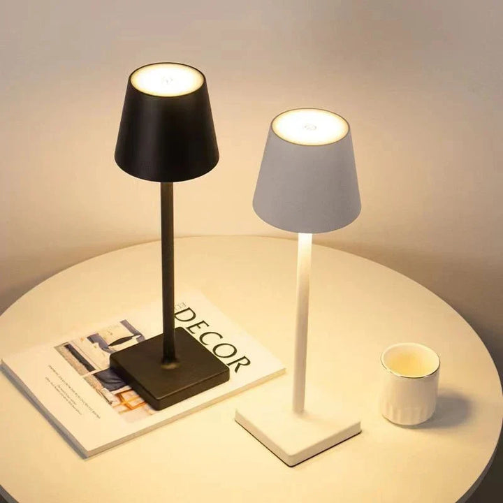 Modern portable LED table lamp, dimmable, rechargeable for indoor & outdoor use. Wireless home decor.