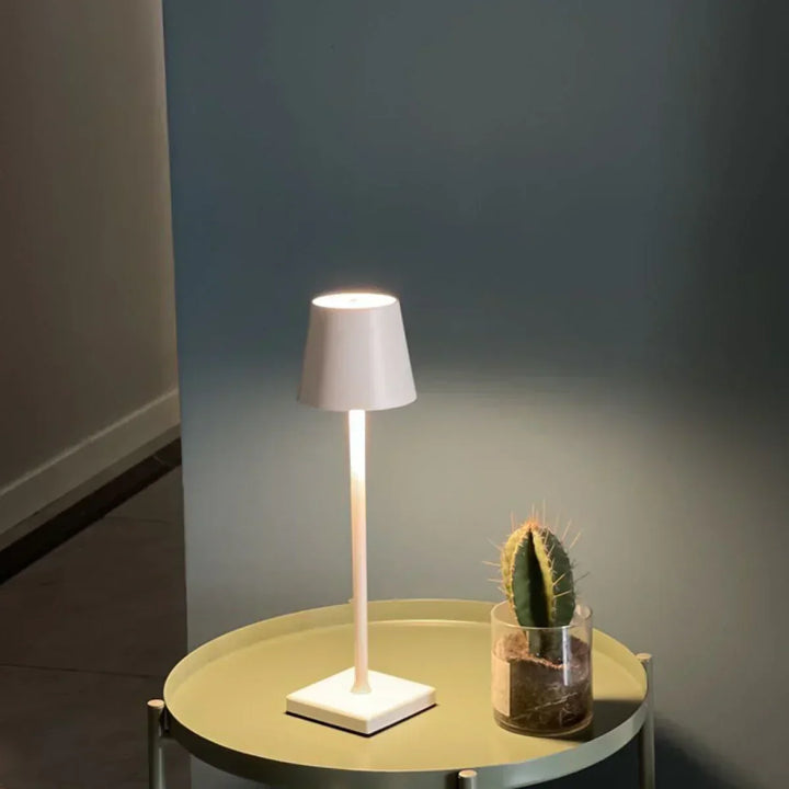 Rechargeable portable LED lamp for outdoor dining & patio lighting. Dimmable and wireless, perfect for ambiance.