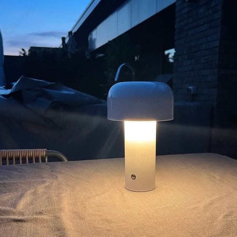 Sleek modern USB table lamp on a nightstand, offering soft ambient LED light for bedrooms.