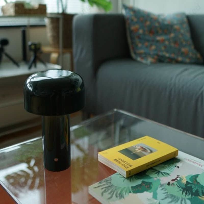 Rechargeable LED table lamp with USB charging for portable and convenient ambient lighting.