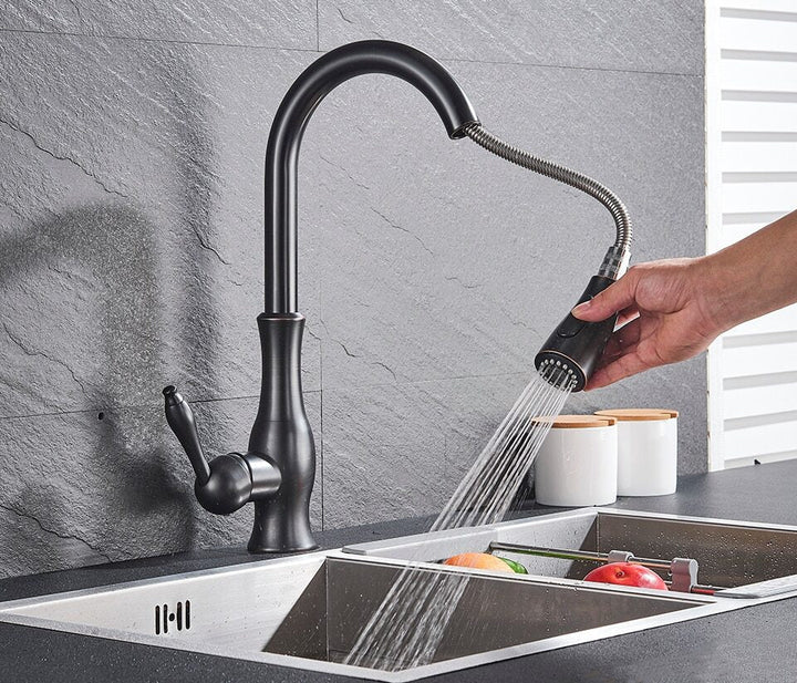 Sleek black pull-out kitchen faucet, a modern retractable tap for kitchen improvement.