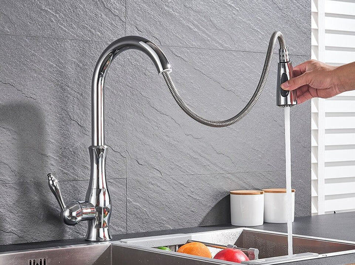 Brushed steel retractable kitchen faucet, a practical & modern pull-out tap for home improvement.