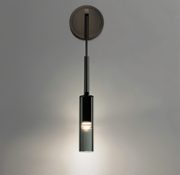 Elegant Orvane smoke glass wall lamp, modern minimalist design, adds ambient light to modern interiors.