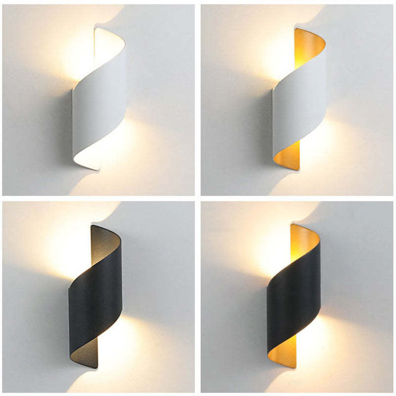 Illuminate your space with a modern spiral LED wall light, a decorative and efficient sconce.