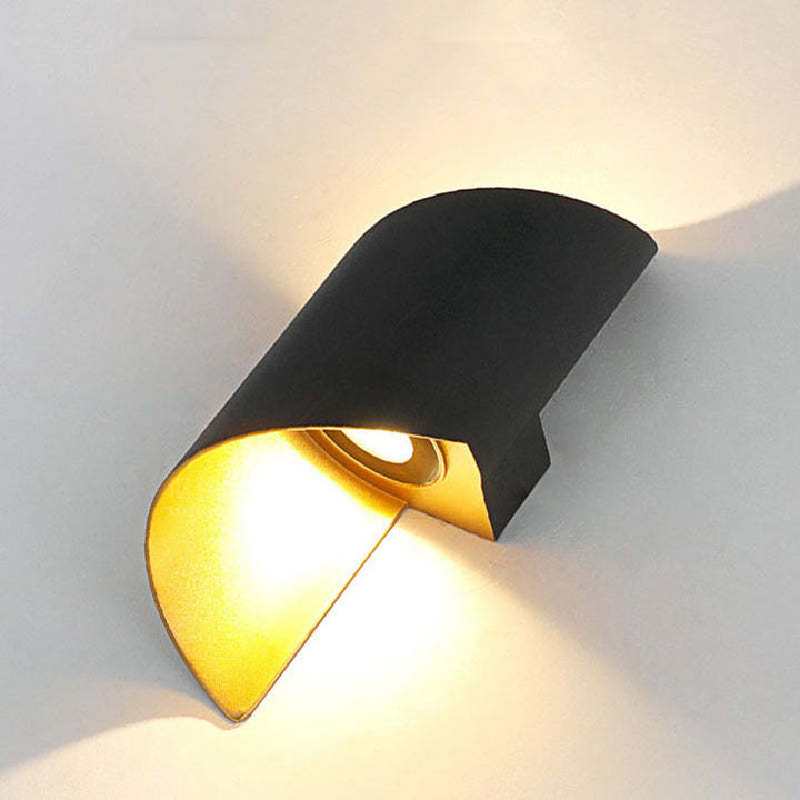 Artistic modern spiral LED wall sconce, providing elegant light for indoor/outdoor spaces.
