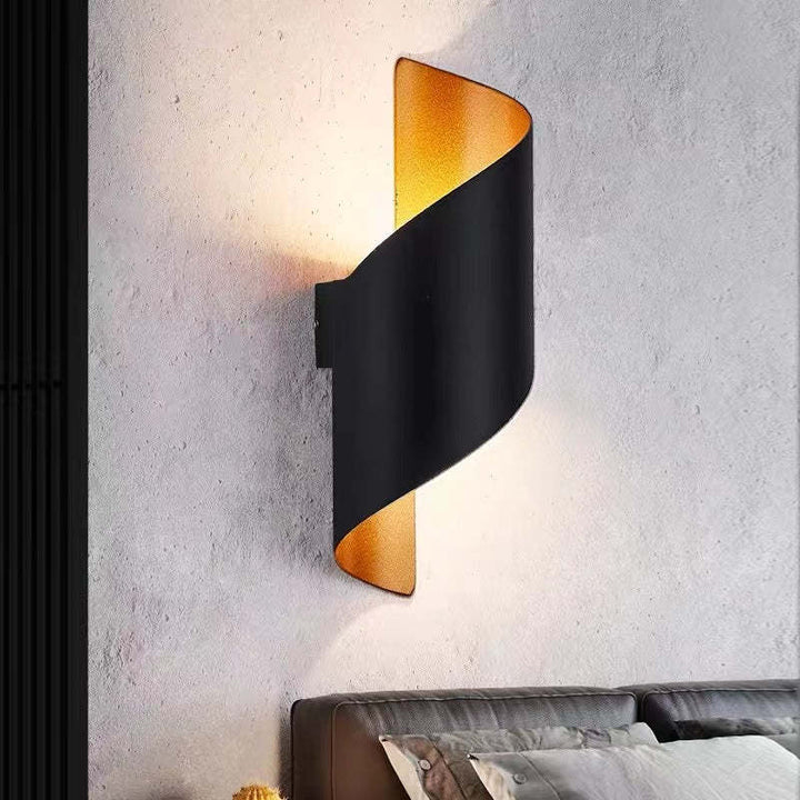 Modern spiral LED wall light fixture, offering stylish and energy-efficient illumination.