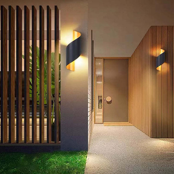 Sleek spiral LED wall sconce, perfect for modern indoor living rooms or outdoor patios.
