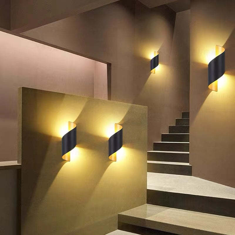 Stylish spiral LED wall lamp for modern homes, suitable as indoor or outdoor lighting.